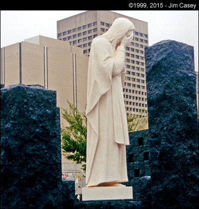 A statue stands with eyes covered at the OKC bombing memorial.