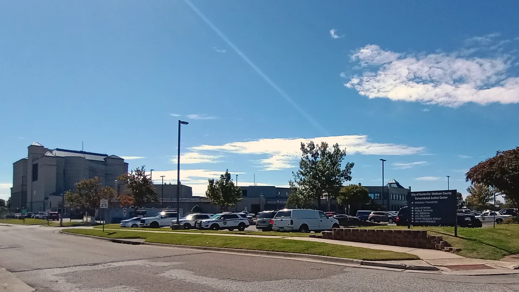 Huntsville's Police Department is a sprawling complex with officers and citizens walking through more than one parking lot almost continuously. The white pickup with camper shell in the main lot is about where the van was parked that trapped Christina Nance apparently causing her death.