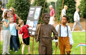 This youngun appears to be mocking a depiction at the dedication of Huntsville's Bicentennial Park in 2005 of a boy in the 1800's who went fishing instead of picking cotton.