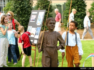 This youngun appears to be mocking a depiction at the dedication of Huntsville's Bicentennial Park in 2005 of a boy in the 1800's who went fishing instead of picking cotton.