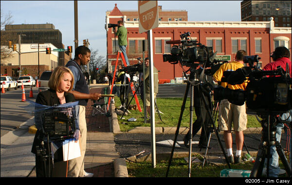 Television crews from Huntsville and Birmingham line up as they prepare to broadcast "live at 5" while others remain vigilant watching the door for a sign of Rudolph's emergence.